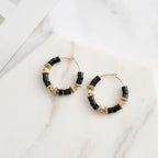 Noir Orbit Hoop Earrings close-up view