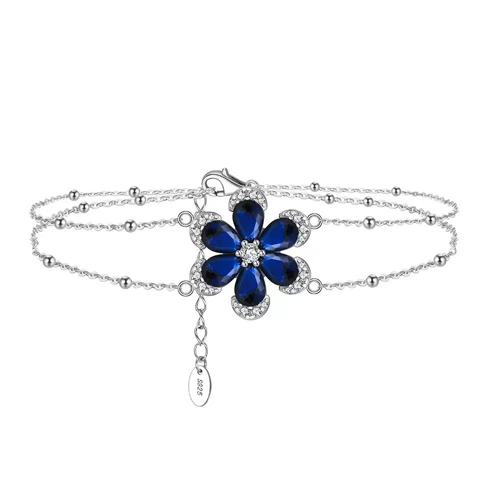 Floral Elegance – Sterling Silver & Sapphire Blossom Chain Bracelet
