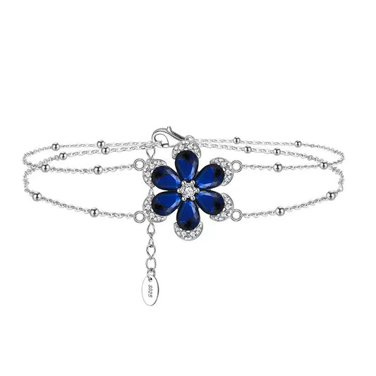 Floral Elegance – Sterling Silver & Sapphire Blossom Chain Bracelet