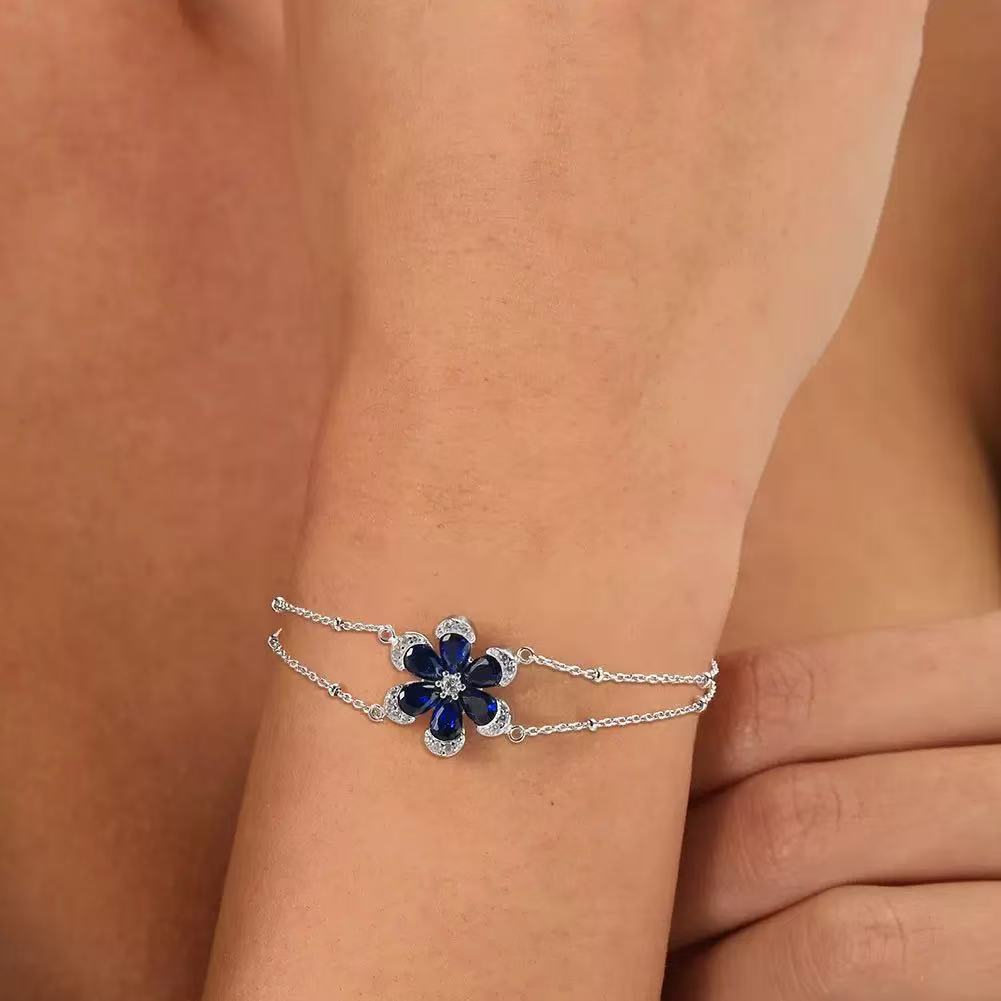Floral Elegance – Sterling Silver & Sapphire Blossom Chain Bracelet