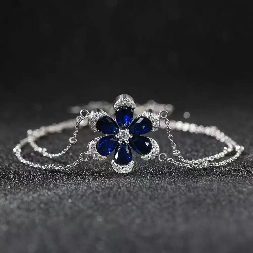 Floral Elegance – Sterling Silver & Sapphire Blossom Chain Bracelet