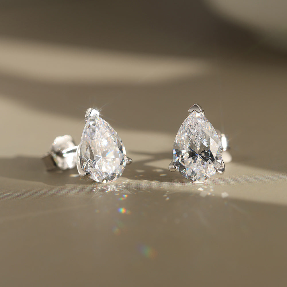 Pear Cut Moissanite Solitaire Stud Earrings — product and styling view