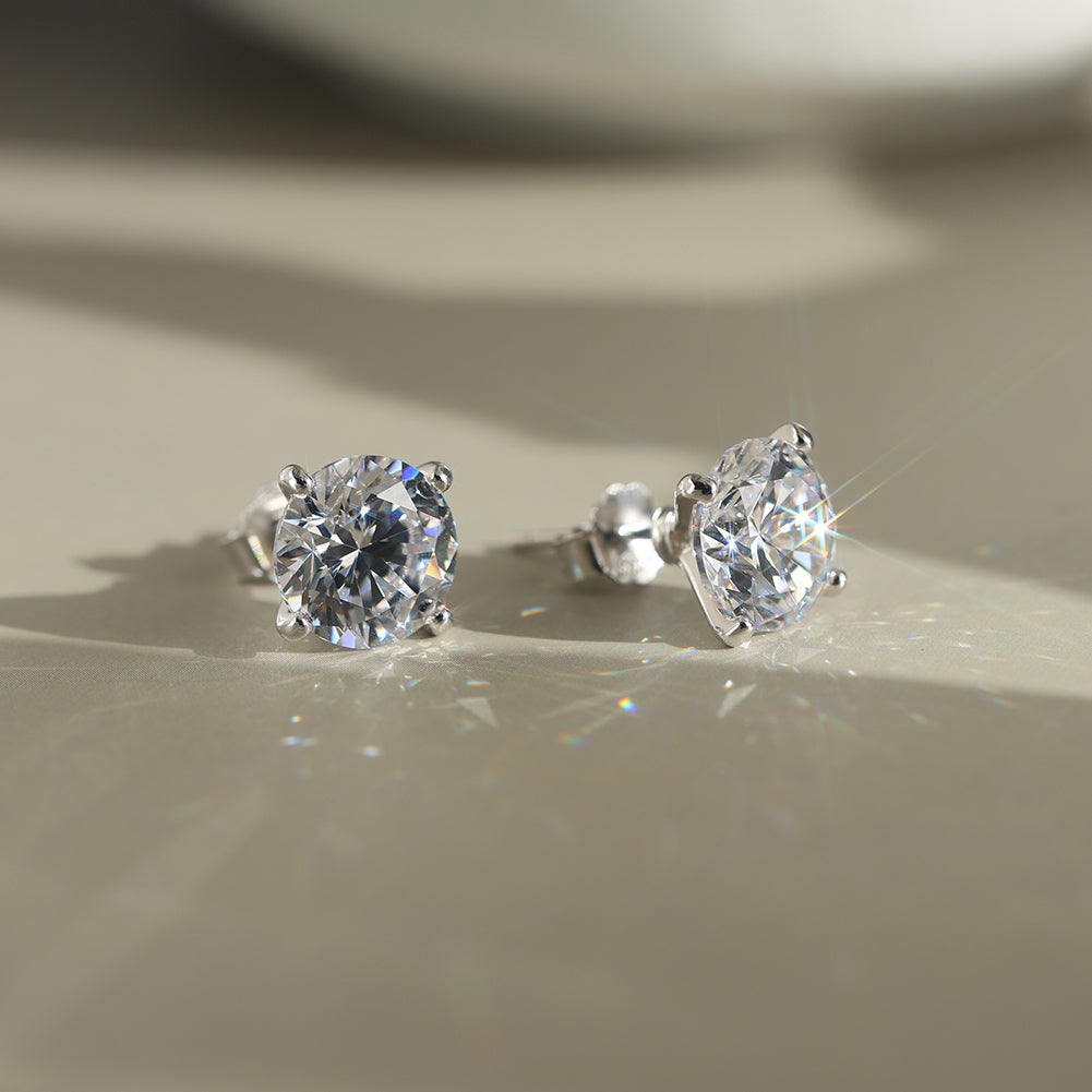 Four Prong Round Moissanite Stud Earrings — product and styling view