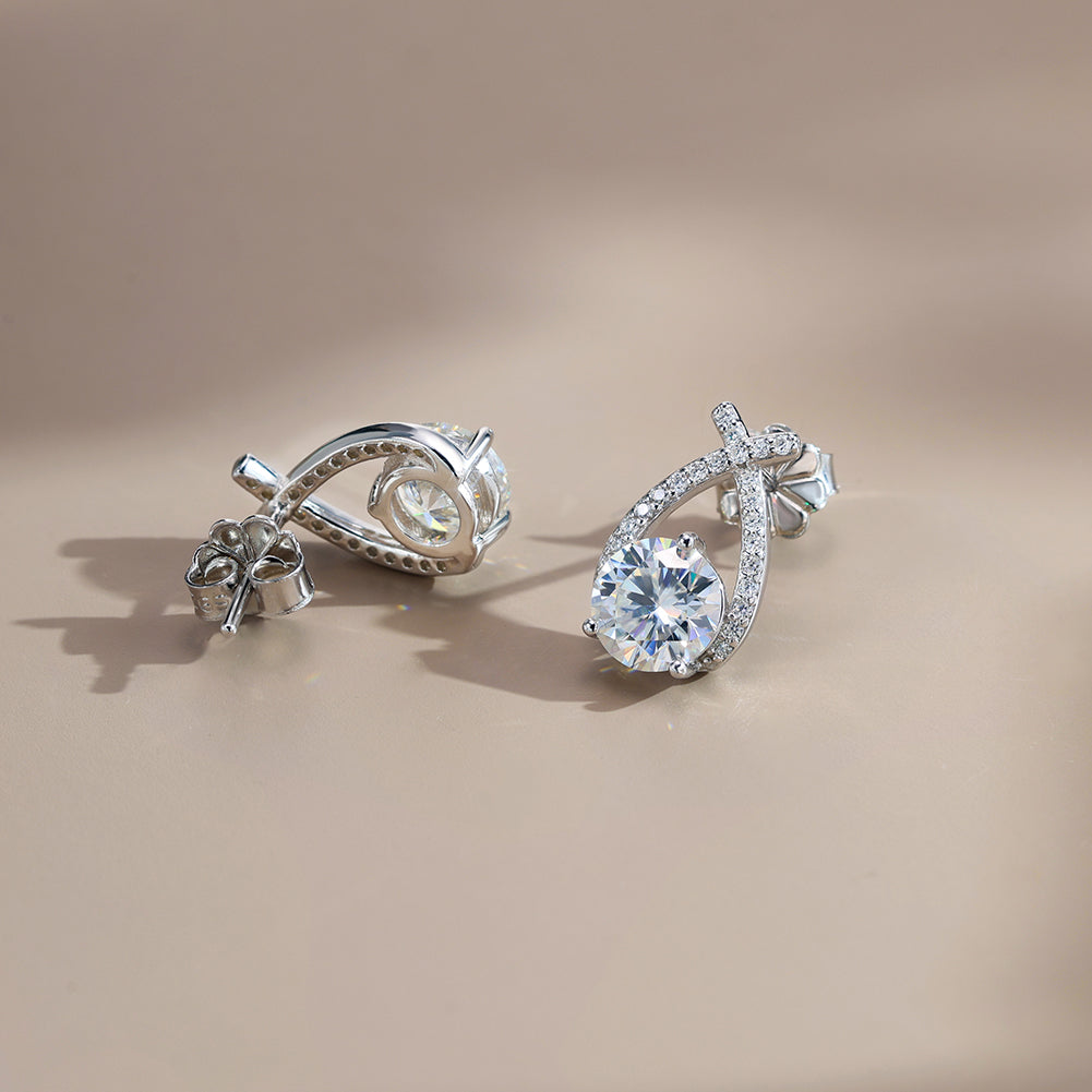 Twist Pear Moissanite Drop Earrings — product and styling view