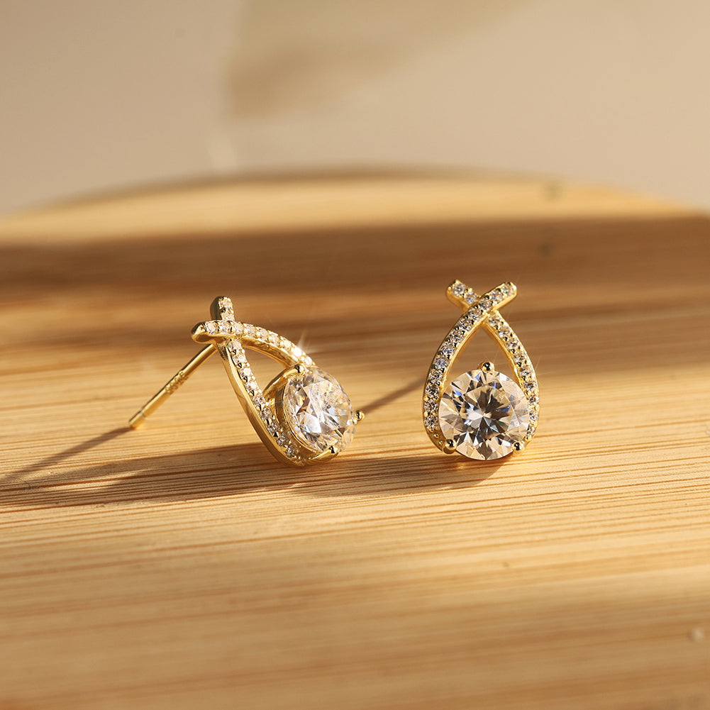 Twist Pear Moissanite Drop Earrings — product and styling view