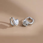 Round Moissanite Huggie Drop Earrings — product and styling view