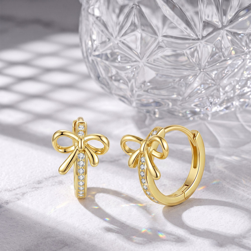 Bow Moissanite Huggie Earrings — product and styling view