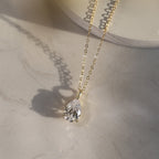 Pear Cut Moissanite Solitaire Pendant Necklace — product and styling view