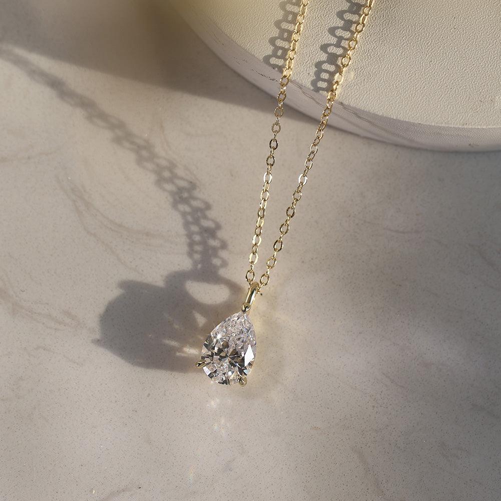 Pear Cut Moissanite Solitaire Pendant Necklace — product and styling view