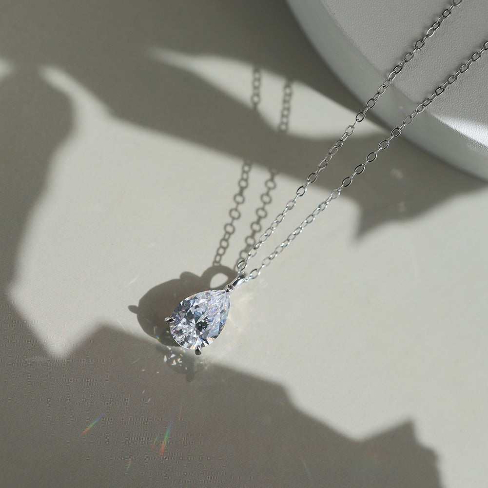 Pear Cut Moissanite Solitaire Pendant Necklace — product and styling view