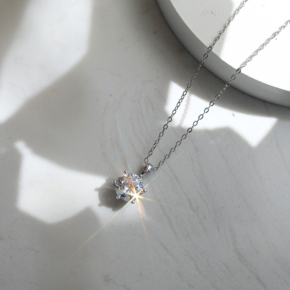 Six Prong Round Moissanite Solitaire Necklace — product and styling view