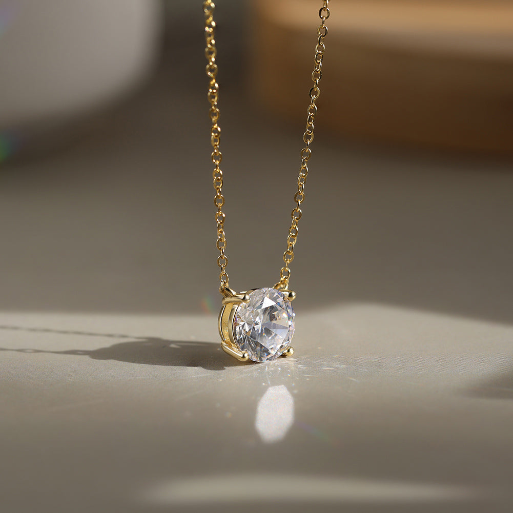 Four Prong Round Moissanite Solitaire Necklace — product and styling view