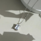 Emerald Cut Moissanite Solitaire Necklace — product and styling view