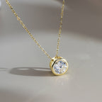 Bezel Round Moissanite Solitaire Necklace — product and styling view