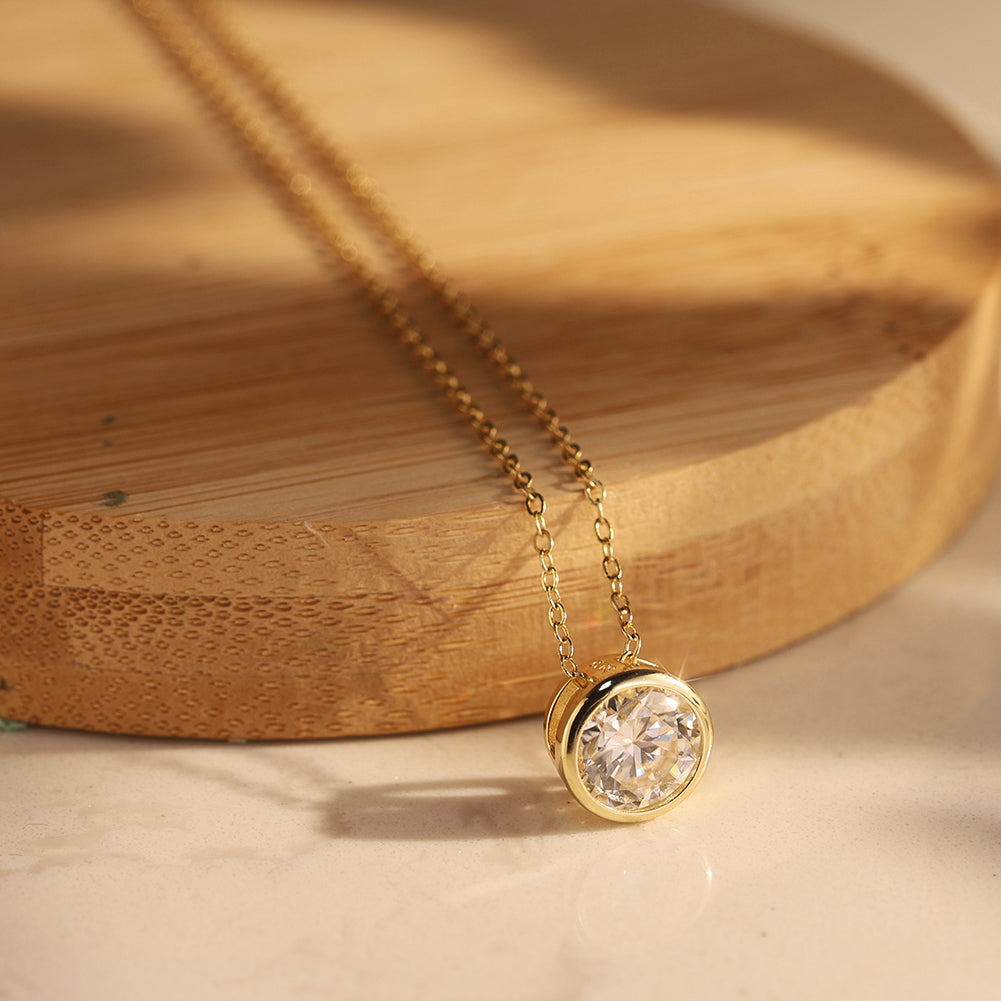 Bezel Round Moissanite Solitaire Necklace — product and styling view