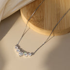 Heart and Round Moissanite V Necklace — product and styling view