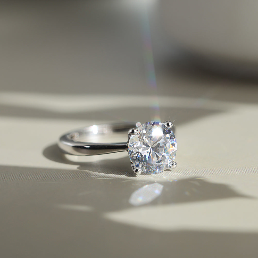Four Prong Round Moissanite Adjustable Ring — product and styling view